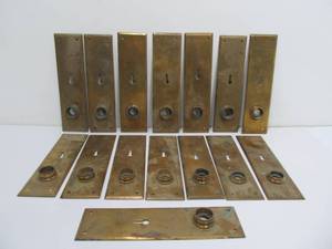 lot 136 image: Lot of 15 Matching Antique Brass Door Hardware Keyhole Plates