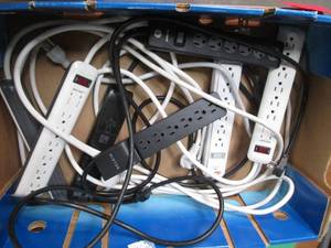 Box containing multiple power strip...