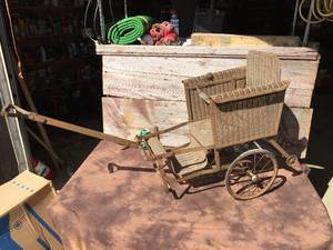 lot 141 image: Antique Lloyd Loom Products Convertible 2 Wheel StrollerCarriage
