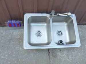 Dual stainless sink with faucet . Store display. As shown.