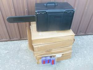 Qty of 5 new chain saw cases. Need to be assembled. May be missing a few parts. Display not included. As shown.
