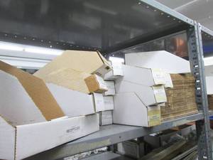 Stack of Unassembled Cardboard Part...