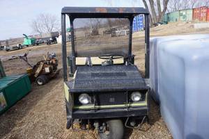 lot 33 image: Cushman 3 Wheel Utility Cart With Dump Box