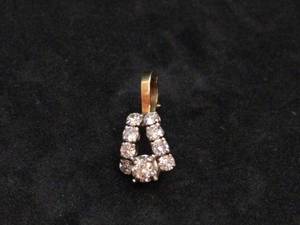 lot 134 image: 14k Gold Pendant with Eight Stones