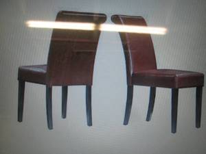 2 black faux leather parsond chairs...