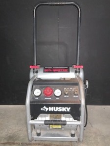 lot 50 image: HUSKY 4.5 GAL. PORTABLE ELECTRIC-POWERED SILENT AIR COMPRESSOR. SEE PICTURES