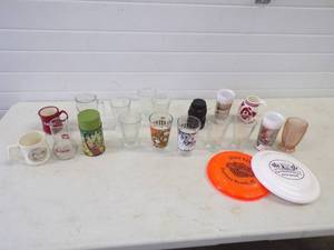 lot 18 image: Aladdin Tarzan Thermos, Collectable Glasses and Frisbees