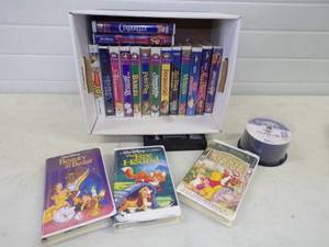 lot 76 image: Disney VHS Tapes and DVD Disks