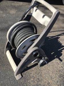 lot 103 image: Suncast Rolling Hose Cart With Hose