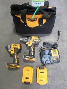 lot 34 image: Dewalt ATOMIC 20-Volt MAX Cordless Brushless Compact 12 in. DrillDriver ( HAS ISSUES) with ATOMIC 20-V Brushless Impact Driver With Batteries and Charger - DCD708C2W809 - Used.