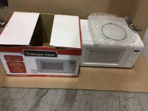 lot 7 image: 0.7 cu. ft. Countertop Microwave in White by Magic Chef Customer retturns See Pictures