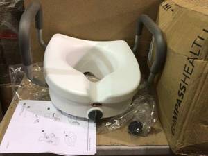 lot 41 image: E-Z Lock Raised Toilet Seat with Armrests Customer retturns See Pictures