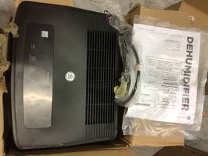 lot 60 image: 50 pt. Dehumidifier for Wet Rooms up to 1500 sq. ft. in Black, ENERGY STAR by GE Customer retturns See Pictures
