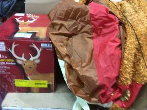 lot 62 image: 10.5 ft. Pre-Lit LED Giant-Sized Inflatable Fuzzy Standing Reindeer Customer retturns See Pictures