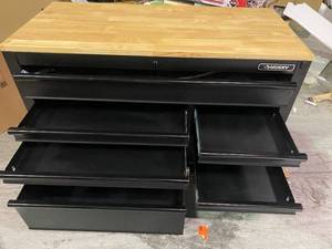 lot 111 image: Heavy-Duty 52 in. W 9-Drawer, Deep Tool Chest Workbench in Matte Black with Adjustable-Height Hardwood Top missing wheels by Husky Customer Returns See Pictures