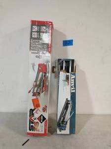 lot 23 image: RUBI TILE CUTTER  AND ANVIL 14IN TILE CUTTER