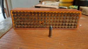 lot 310 image: Lot of 100 22 Long Rifle Rounds in Case  (1) Thunderbolt & (8) Super X 22 Rounds