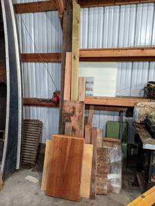 lot 156 image: Lot of Lumber Against Wall