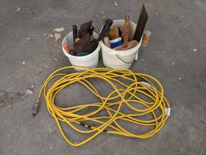 lot 249 image: 2 Buckets of Trowels, Scrapers and More  Yellow Extension Cord