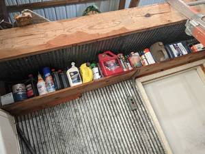 lot 256 image: Contents of Shelf - Oils and Cleaners, Marvel Mystery Oil is nearly full as well as the Johnson 2-Stroke Oil