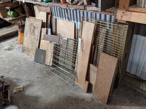 lot 402 image: Large Lot of Wood Pieces, Steel Grates and More against the wall