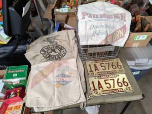 lot 550 image: Pioneer Seed Corn Bags, Morlea Dairy Crate, Matching 1962 License Plates and More