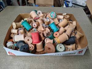 lot 552 image: Box full of Old Wood Sewing Thread Spools