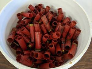 lot 68 image: 5 Gallon Bucket Winchester 12 GA  2.75 & 3 Spent Shotgun Shells