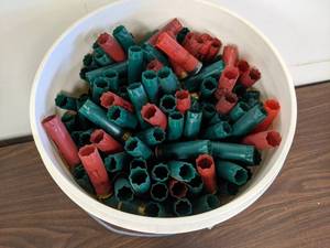 lot 74 image: 5 Gallon Bucket Remington & Winchester 12 GA  2.75 Spent Shotgun Shells