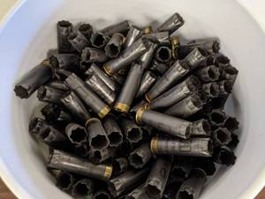lot 76 image: 5 Gallon Bucket Winchester 12 GA  2.75 Spent Shotgun Shells