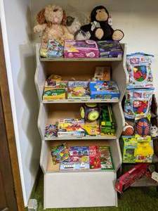 lot 180 image: Shelf with Assorted NEW Toys - Legos, John Deere, Games and More