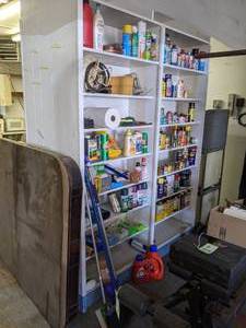 lot 220 image: 8 Shelves of Cleaning Products, Car Stereo and More