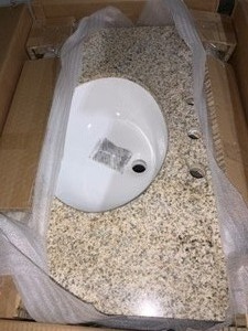 lot 54 image: HOME DECORATORS TERRYN 31 IN. W X 35 IN. H X 20 IN. D VANITY IN CHERRY WITH GRANITE VANITY TOP IN BEIGE WITH WHITE BASIN. SEE PICTURES