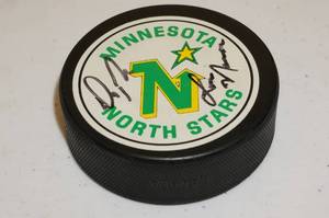lot 42 image: Minnesota North Stars Signed Puck - Lou Nanne