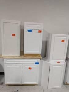 lot 52 image: LOT OF 8 HAMPTON BAY  KITCHEN CABINETS IN WHITE