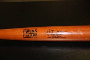 lot 60 image: Minnesota Twins Justin Morneau SGA Commemorative Baseball Bat