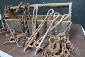 lot 55 image: VINTAGE WOODEN HANDLED BOX WITH CHAINS, HOOKS AND GOODIES.