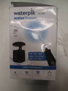 lot 143 image: Waterpik Water Flosser Ultra...