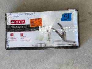 lot 51 image: Delta Foundations Single-Handle Standard Kitchen Faucet with Side Sprayer in Stainless