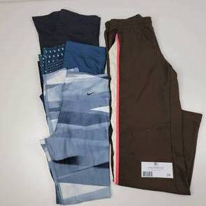 4 Womens Athletic Pants-(1) Medium Calvin Klein Black Capri Leggings, (1) Medium Green Under Armour Leggings, (1) Medium Green Patterned Nike Dri-Fit Leggings, (1) Medium Ativa Track Pants