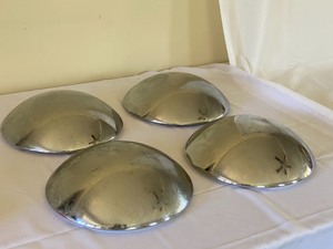lot 63 image: Four Volkswagen Hubcaps