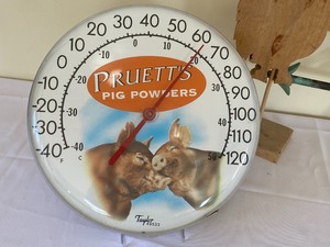 lot 88 image: Pruetts Pig Powders Barometer and Pig Metal Weather Vane