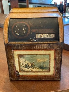 lot 218 image: Antique Country Store Peppery Tin w Roll Back Lid