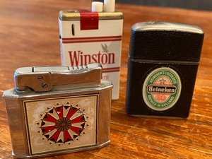 lot 393 image: Three Vintage Lighters Winston, Heineken and a Decorative Lighter
