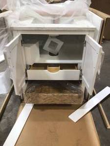 lot 22 image: Newhall 30 in. W x 22 in. D Bath Vanity in White with Cultured Marble Vanity Top - (the top is damaged see pictures ) in White with White Basin
