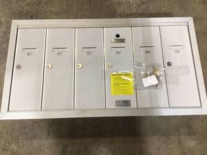 lot 48 image: Florence Vertical Series 6 -Compartment Aluminum Surface-Mount Mailbox not used see pictures