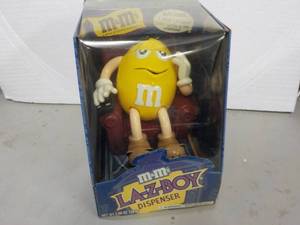 lot 54 image: M & M La-z-boy Dispenser...