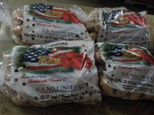 lot 233 image: 4 - 5 lb. Bags Potatoes...