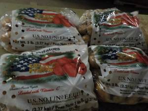 lot 235 image: 4 - 5 lb. Bags Potatoes...