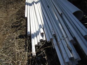 lot 563 image: Approximately 65 Sticks 1 sch 40 PVC Pipe, 1 stick 8 PVC Pipe
